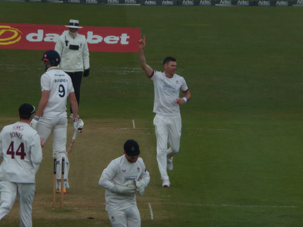 James Anderson celebrates the wicket of Ben McKinney for Lancashire against Durham