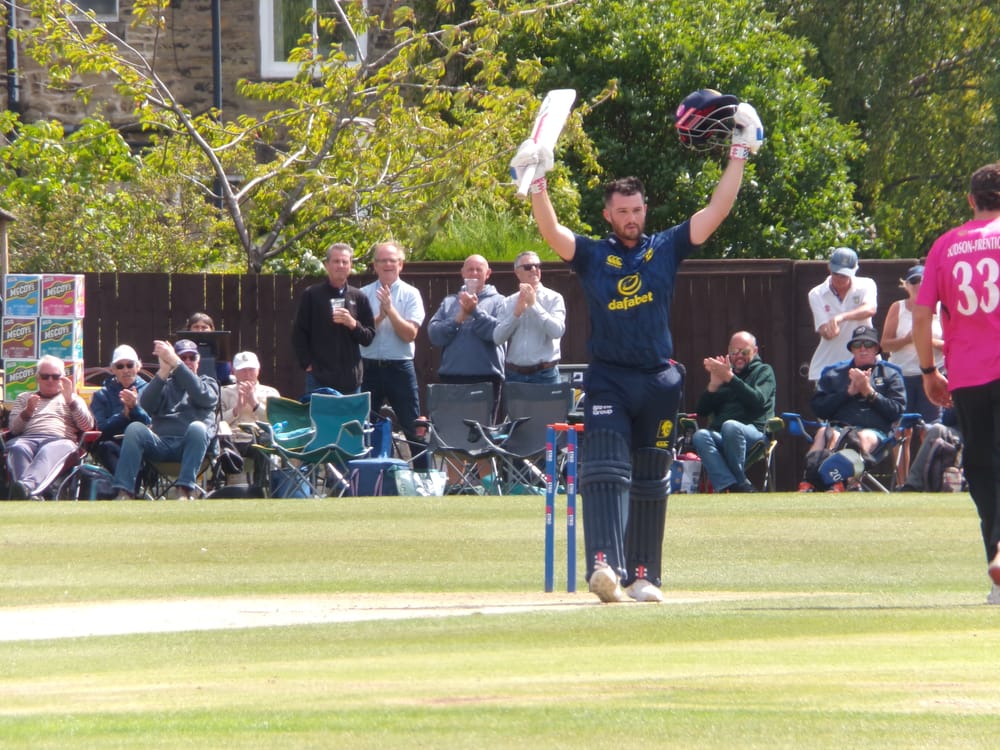 Ollie Robinson celebrates his century against Sussex at South North.