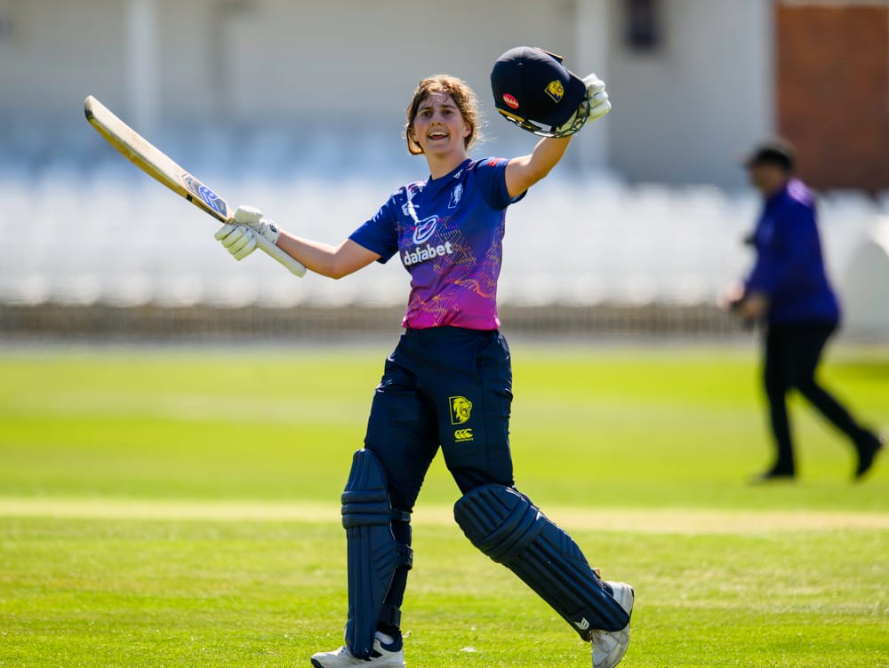 Durham's Phoebe Turner celebrates her century against Yorkshire