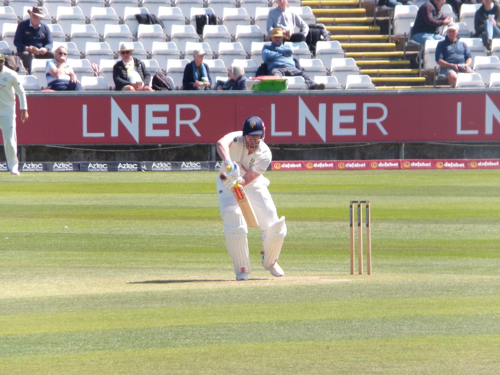 Durham captain Alex Lees defending a ball during a County Championship fixture.