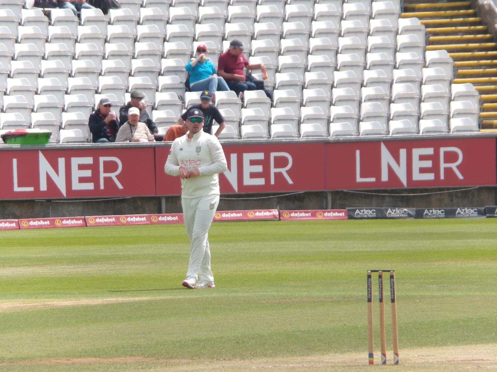 Skipper Alex Lees watches on in the field during a County Championship game last season