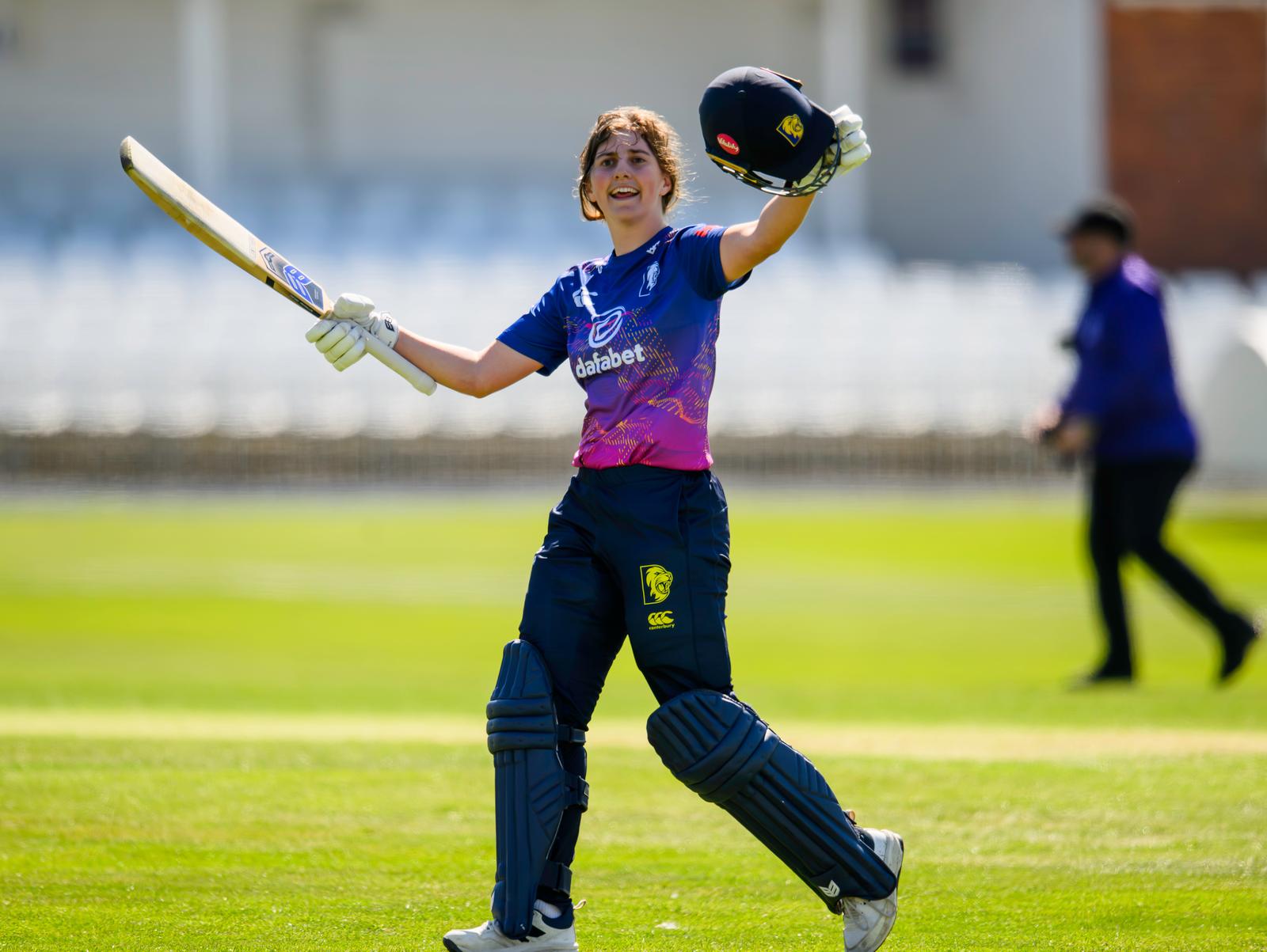 Durham's Phoebe Turner celebrates her century against Yorkshire