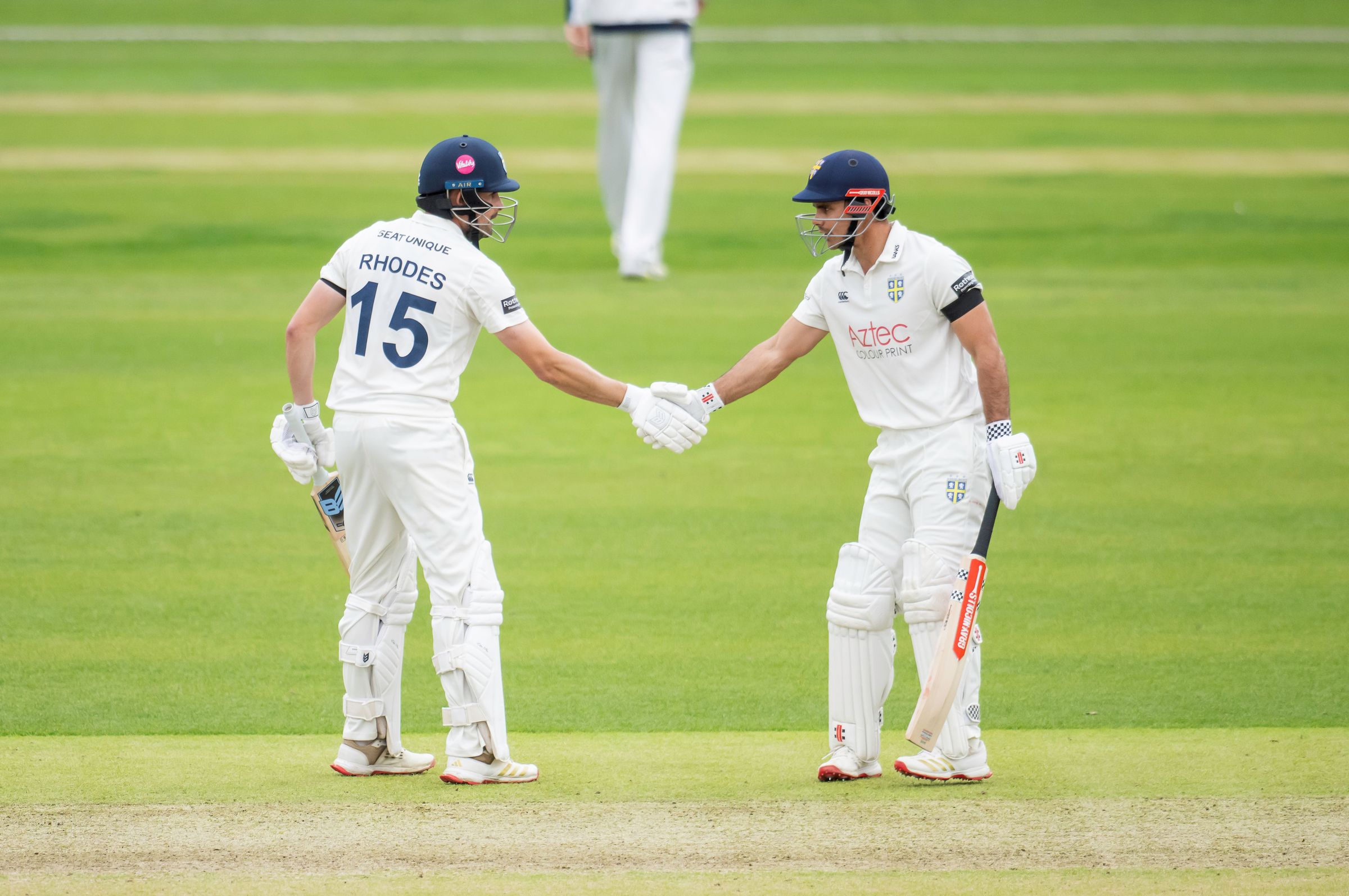 David Bedingham and Will Rhodes punch gloves during Durham's County Championship clash with Yorkshire.