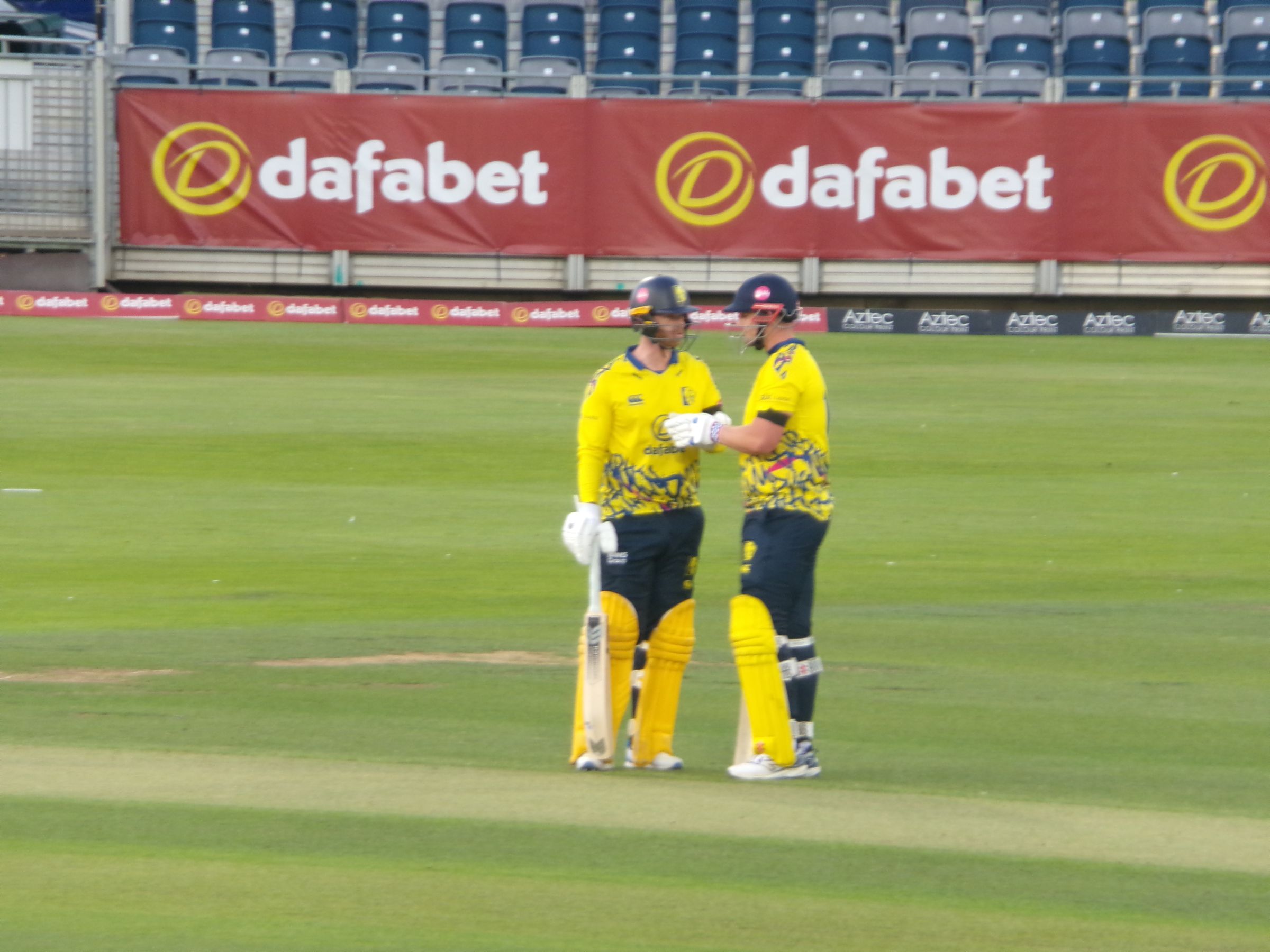 Alex Lees and Graham Clark punching gloves during their record-breaking partnership of 181 against Northamptonshire Steelbacks in the T20 Blast