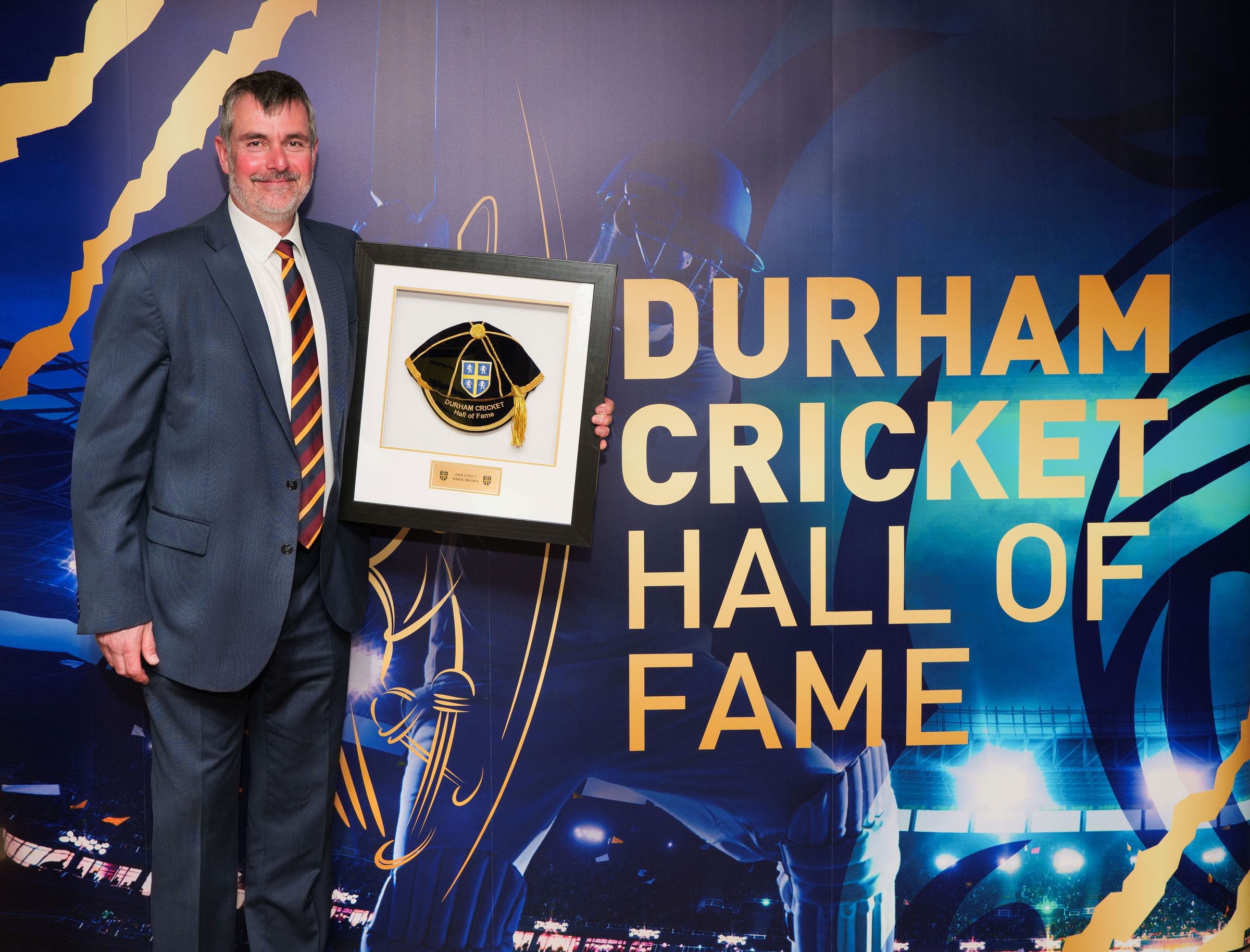 Simon Brown with his award at the 2023 Durham Cricket Hall of Fame awards.